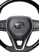 Toyota Corolla Glossy Black Steering Emblem Sporty & Stylish Interior Accessory